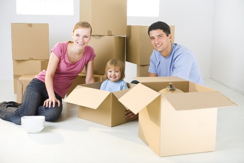 Careful packing of fragile household items for relocation