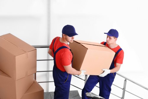 Organised moving day with boxes and furniture in transit