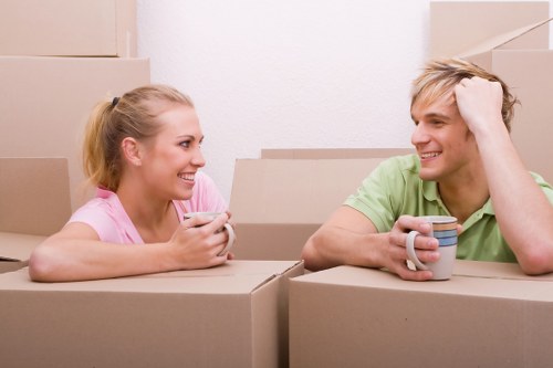 Professional movers handling furniture during an Eastham house move